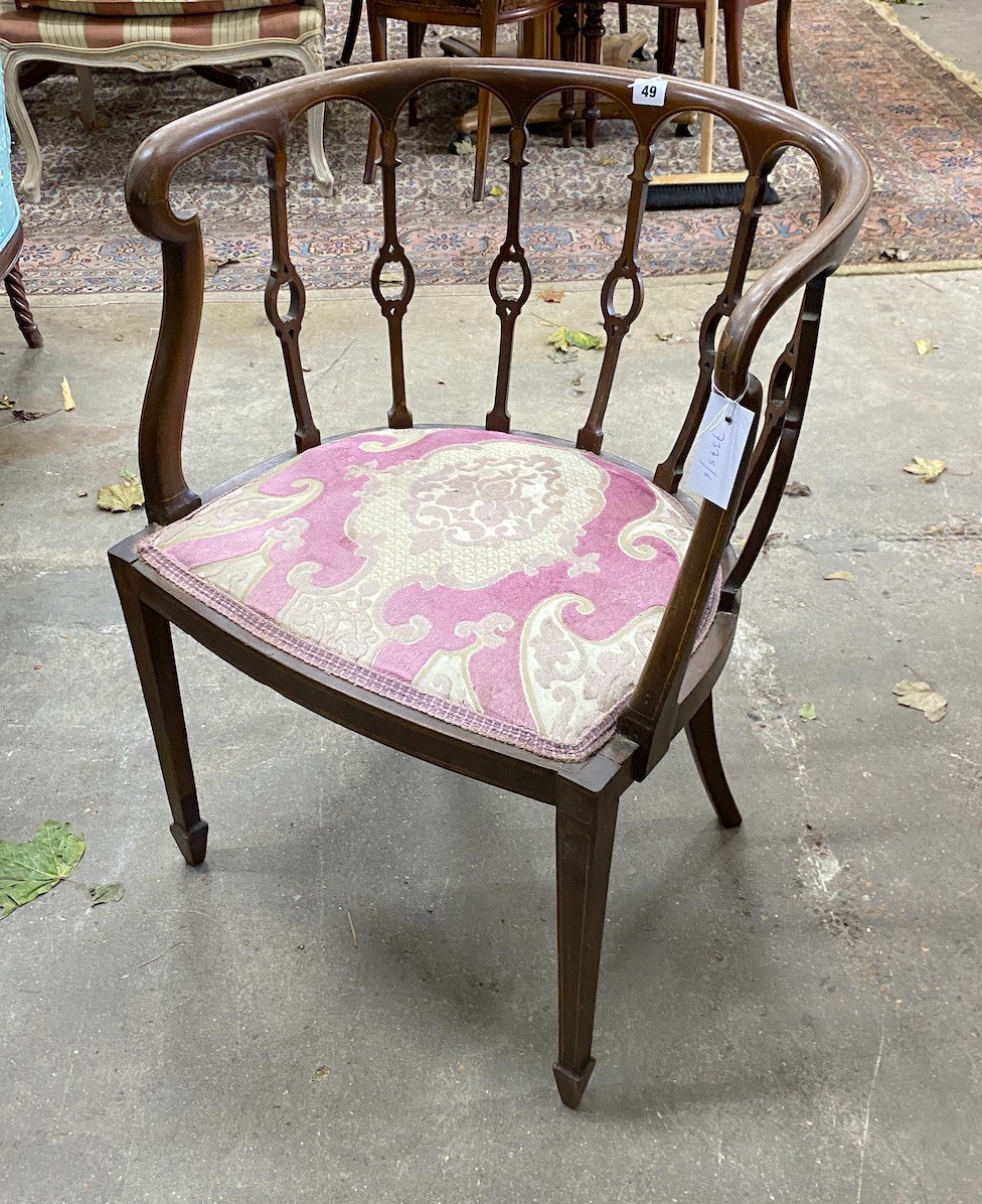 An Edwardian inlaid mahogany tub chair